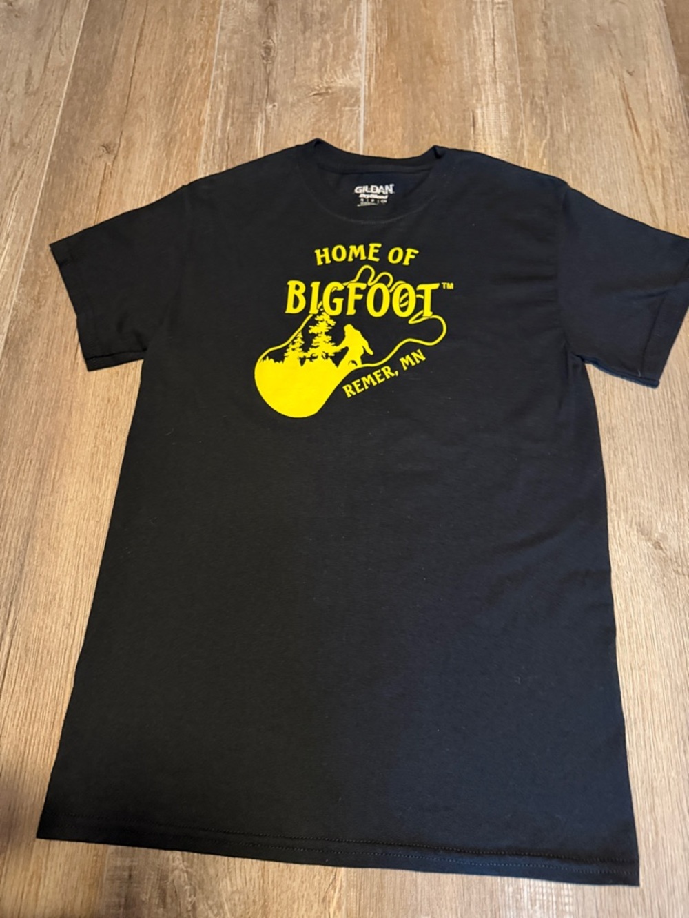 Gildan Black Tee with Yellow "Home of Bigfoot" Remer MN Graphic